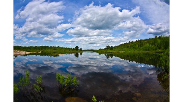 Calm lake with clouds