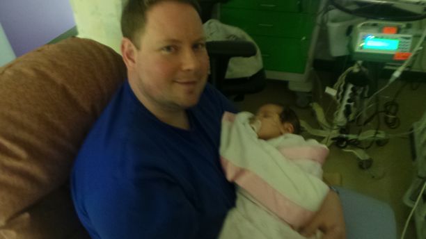 Daddy with his baby in the hospital