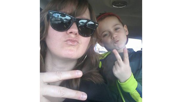 "A peace sign and a duckface"