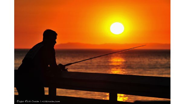 Fisherman at sunset on San Clemente Pier